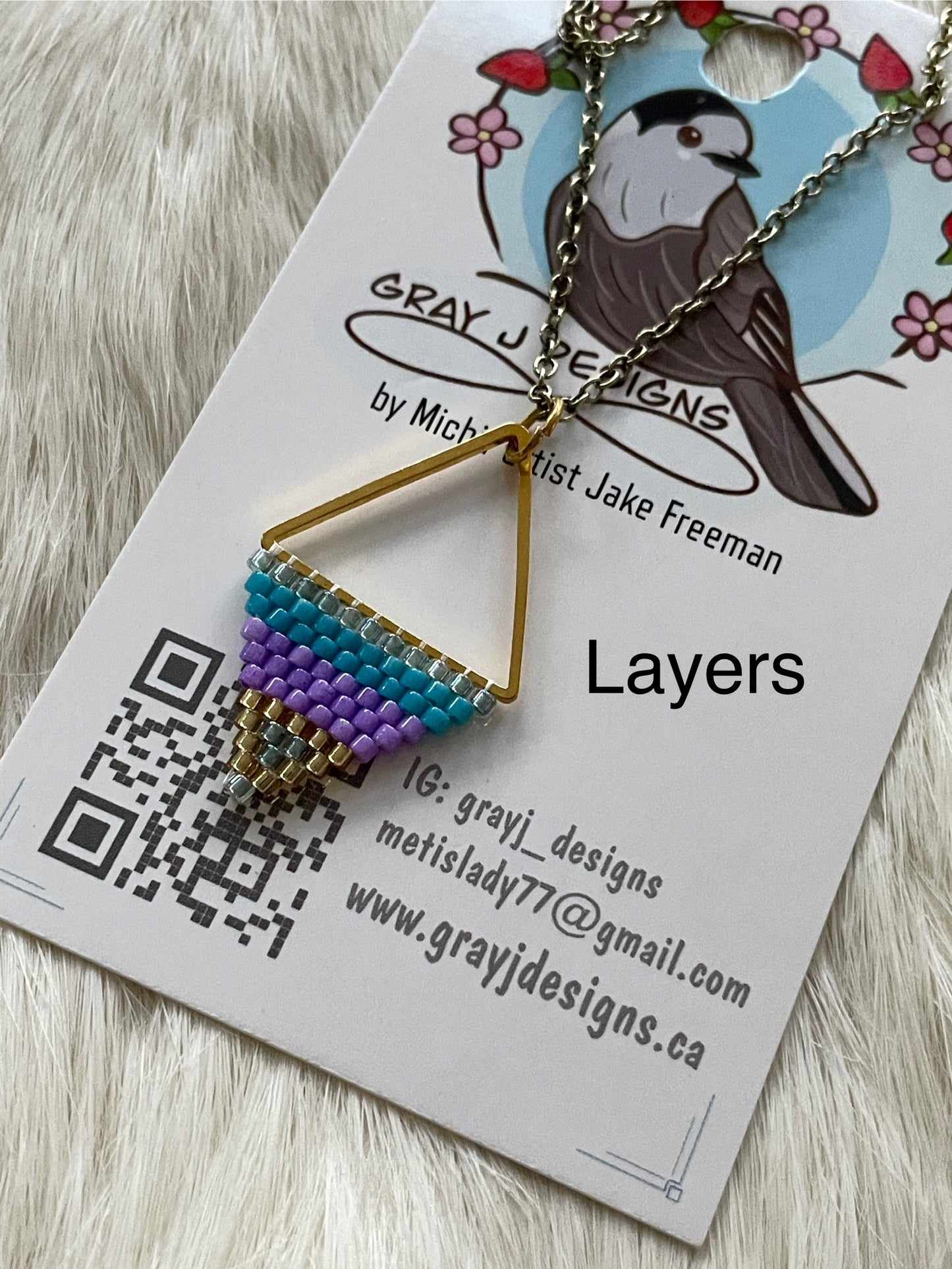 Beaded pendant on metal