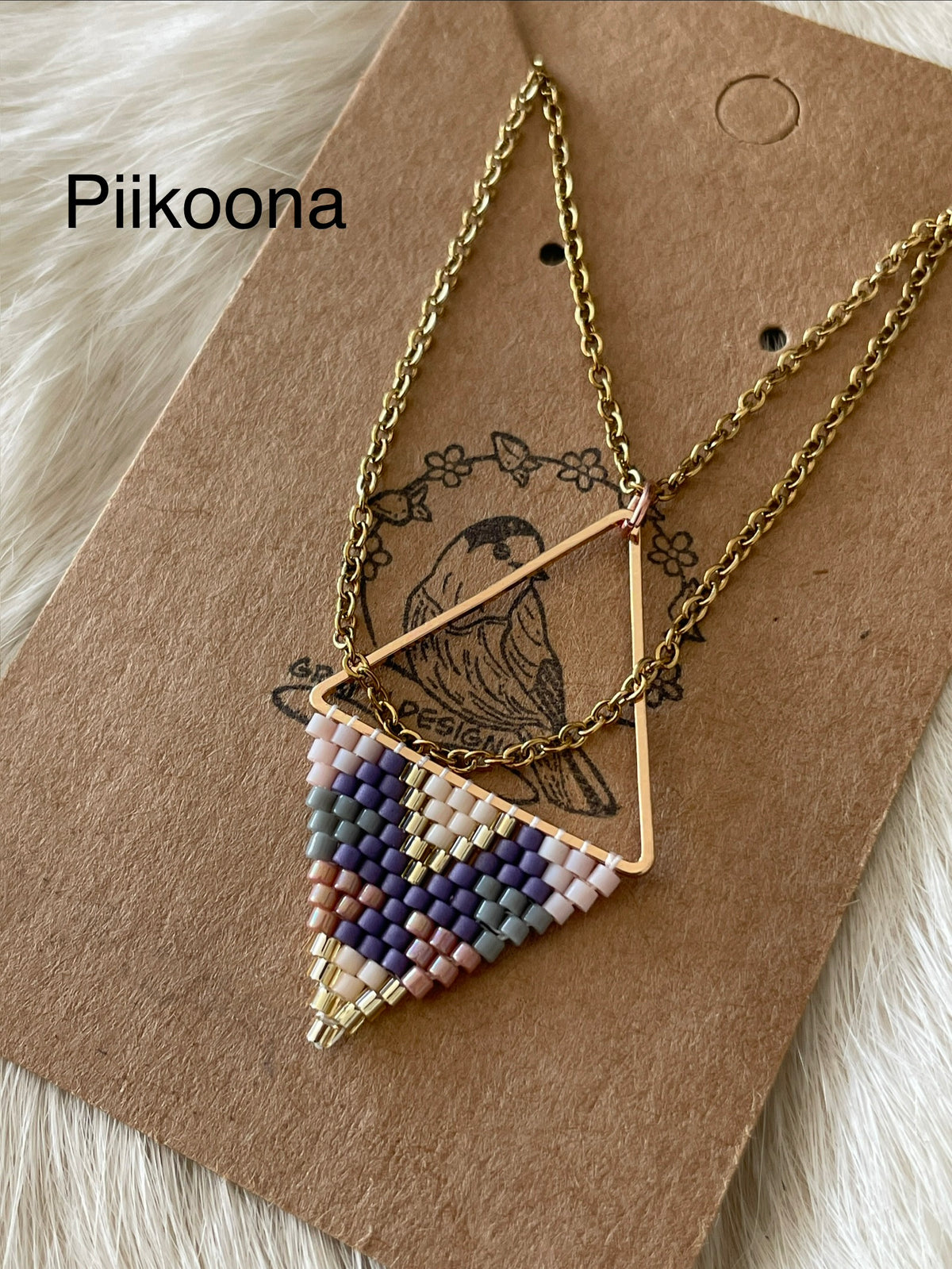 Beaded pendant on metal
