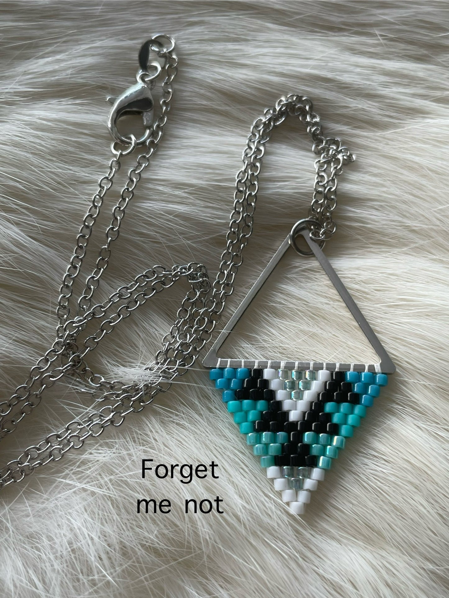 Beaded pendant on metal