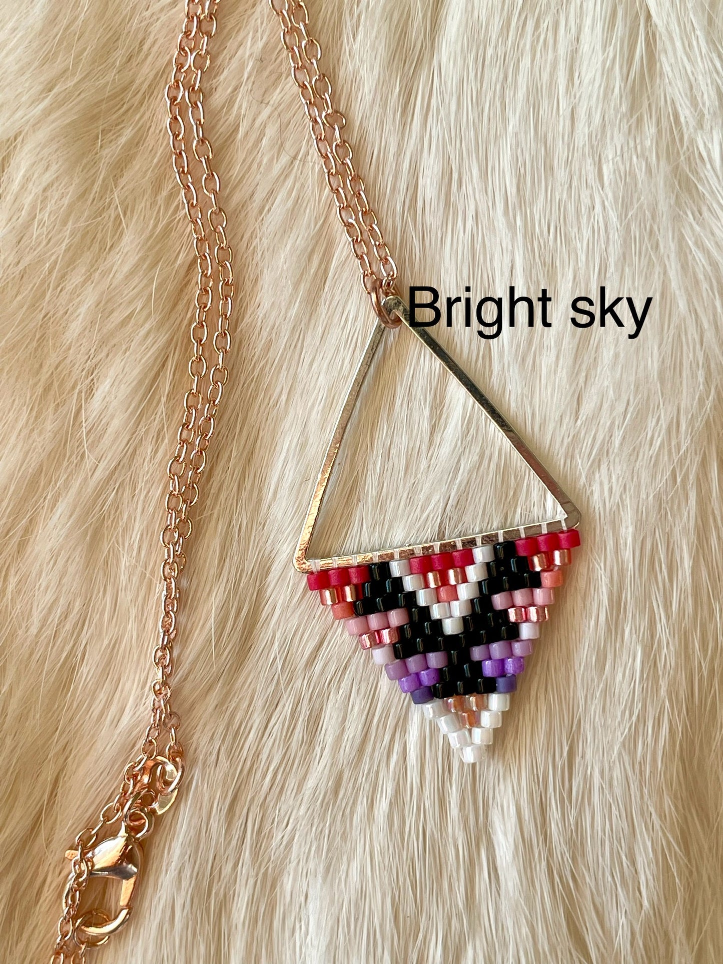 Beaded pendant on metal