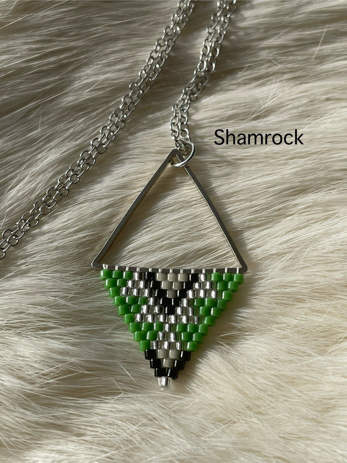 Beaded pendant on metal