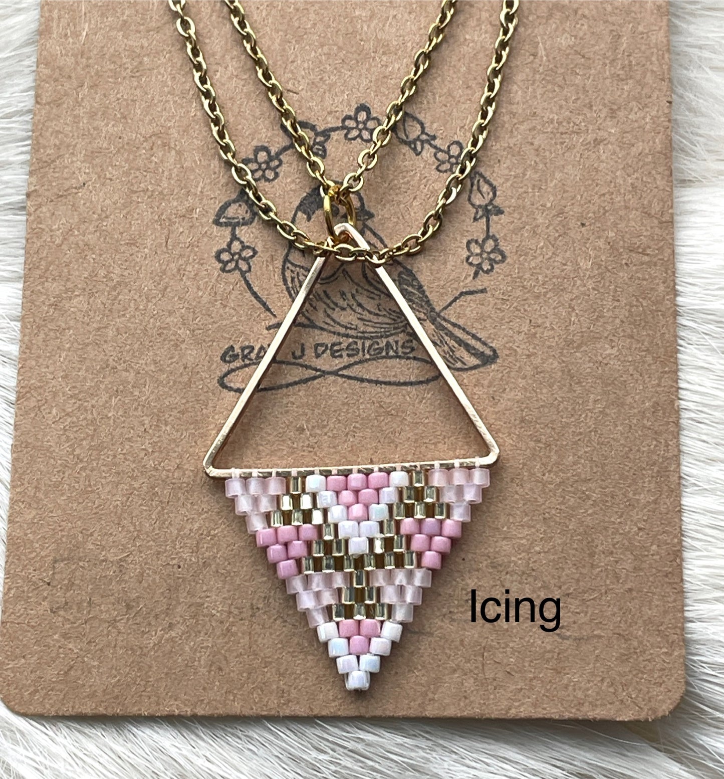 Beaded pendant on metal
